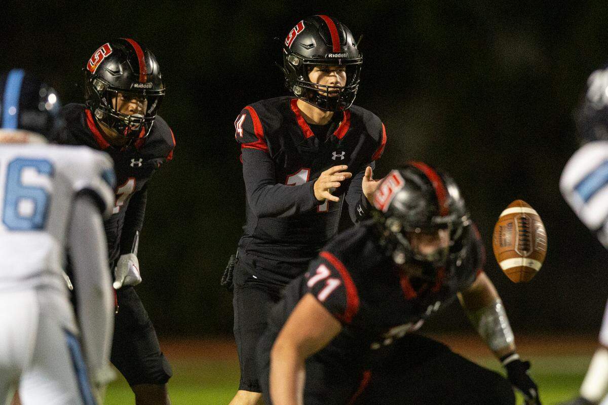 St. Stanislaus’ quarterback Hudson Osborne gets the snap during a playoff game against Port Gibson at St. Stanislaus in Bay St. Louis on Friday, Nov. 4, 2022.