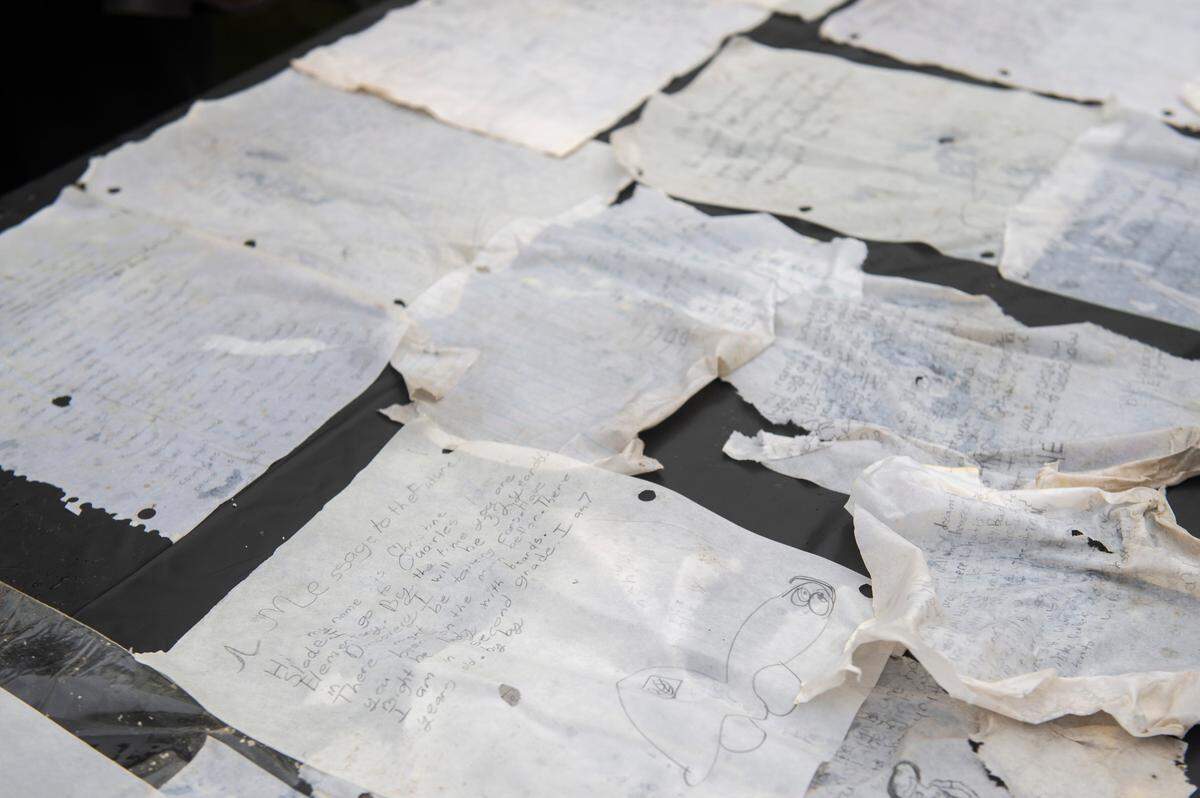 Letters written by to students were among the items from a time capsule that was buried at W. J. Quarles Elementary in Long Beach in 1999 and opened on Friday, Dec. 13, 2024.