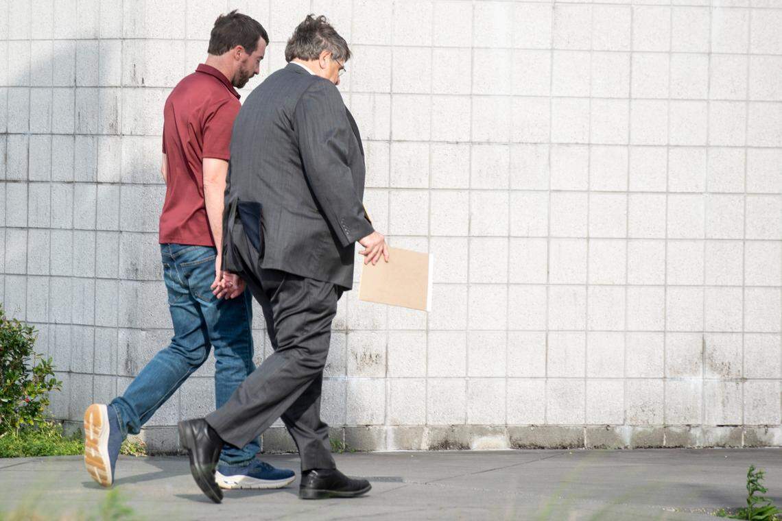 Alan Moran and his attorney, Donald Rafferty, walk into the Hancock County Jail in Bay St. Louis on Friday, March 3, 2023 as Moran surrenders himself following an indictment on felony charges for allegedly assaulting molesting a child and buying him beer.