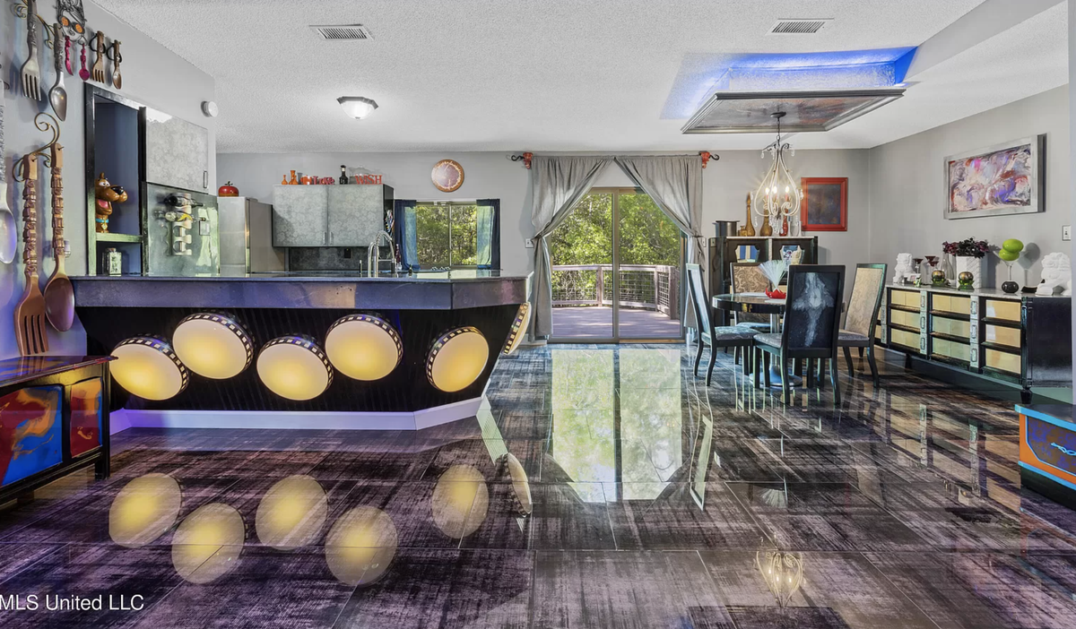A home for sale on Graveline Road in Gautier has purple and orange walls, mirrors and mannequins throughout.