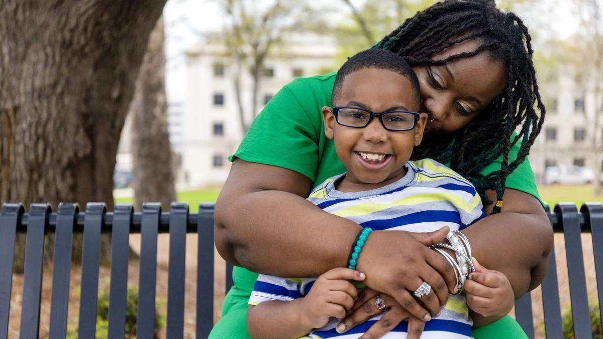 Lakeisha Preston and her son pose for a portrait outside the Capitol in Jackson earlier this month. Due to expensive medical bills incurred in 2019, Lakeisha moved in with her parents and took out personal loans.