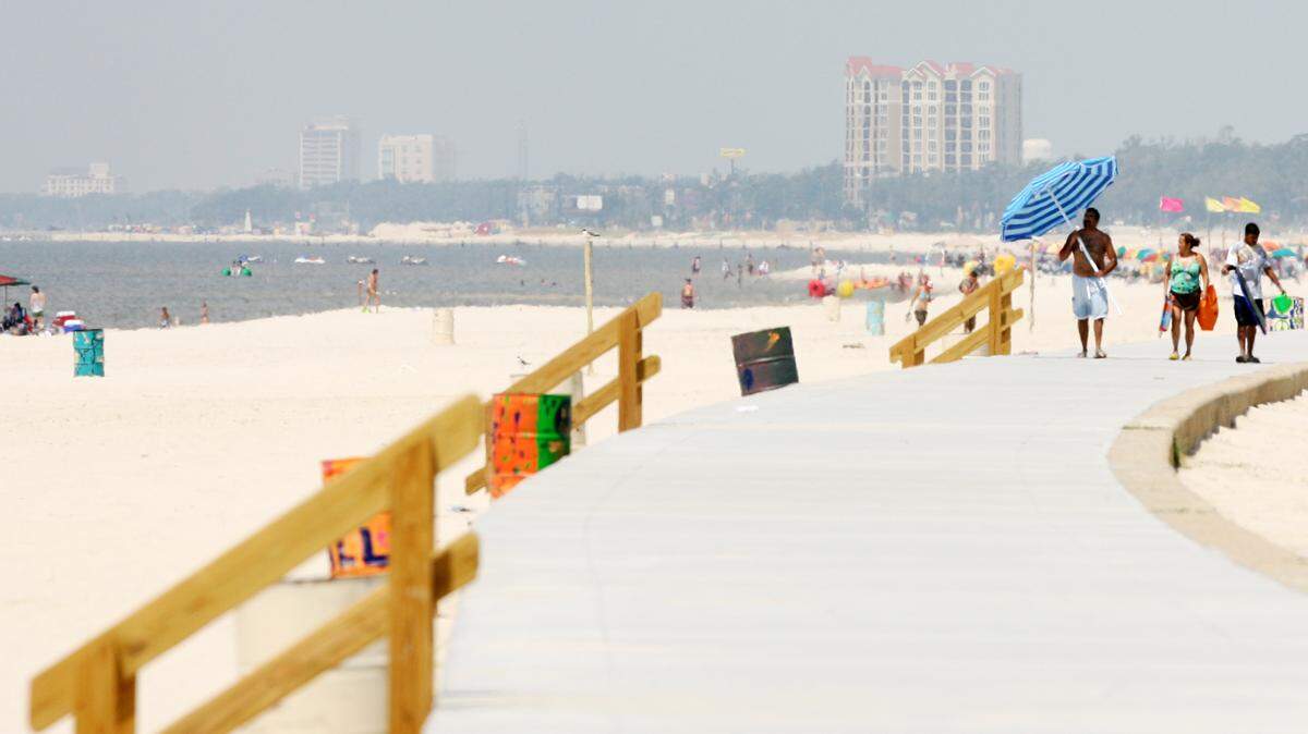 JOHN FITZHUGH/SUN HERALD/FILEBeach visitors enjoy the boardwalk in Biloxi in 2009. The city was awarded $700,000 of its $3 million request for Tidelands money to build a West Biloxi Festival Boardwalk that would run along the water from about Veterans to Rodenberg avenues.