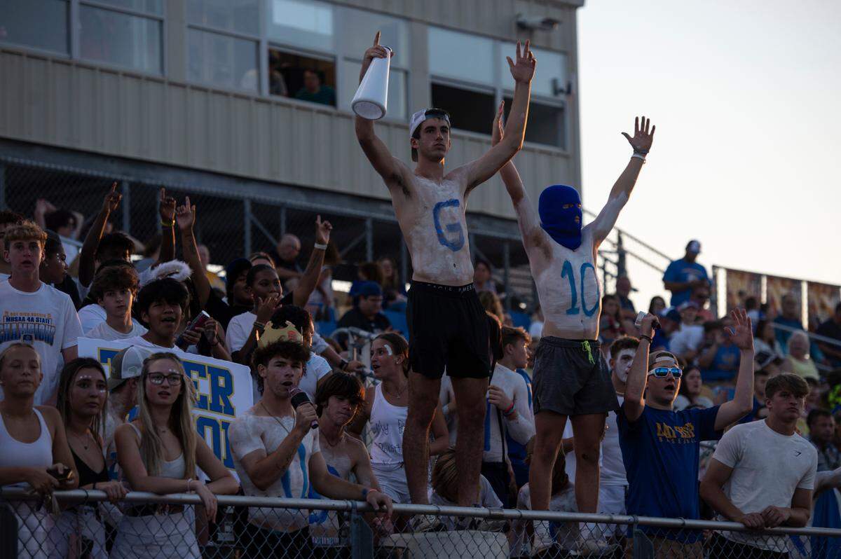The Bay High student section cheers on the Tigers during a game at Bay High in Bay St. Louis on Friday, Sept. 1, 2023.