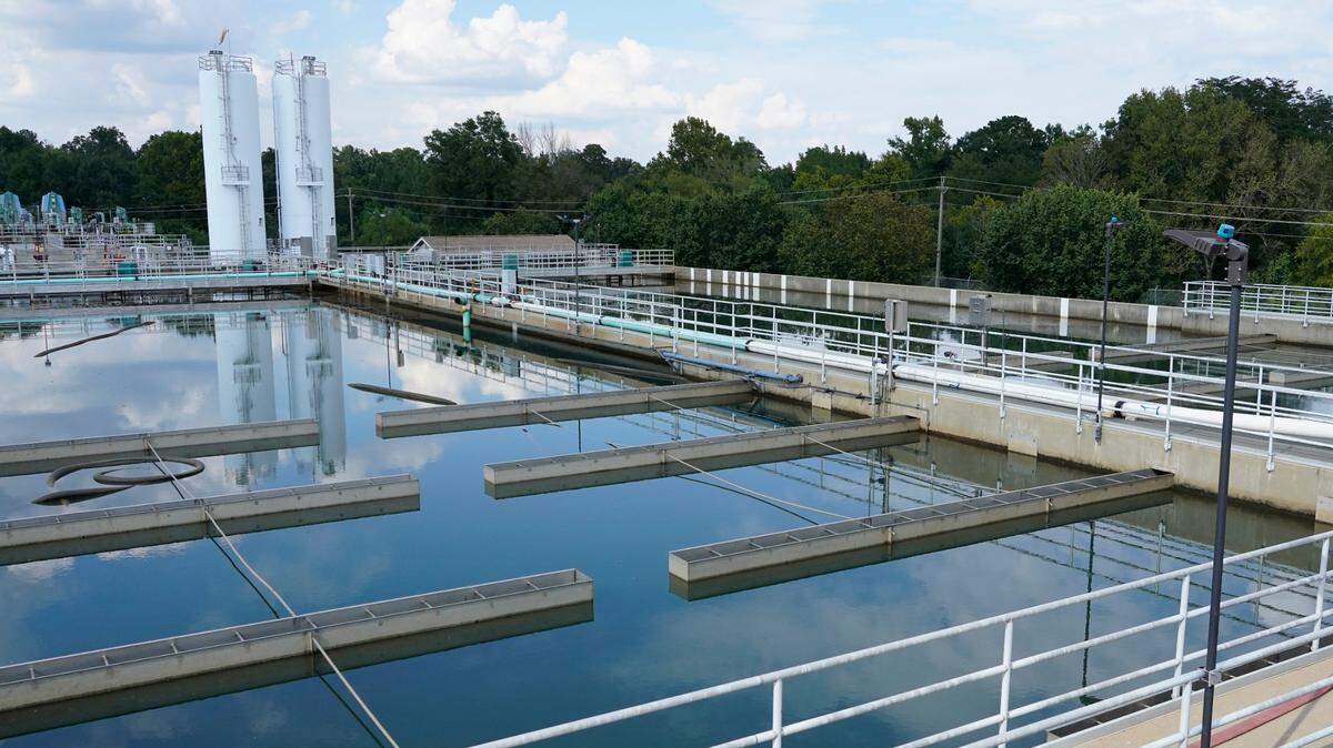 Clouds are reflected off the City of Jackson’s O.B. Curtis Water Treatment Facility’s sedimentation basins in Ridgeland, Miss., Friday, Sept. 2, 2022. Jackson’s water system partially failed following flooding and heavy rainfall that exacerbated longstanding problems in one of two water-treatment plants. (AP Photo/Rogelio V. Solis)