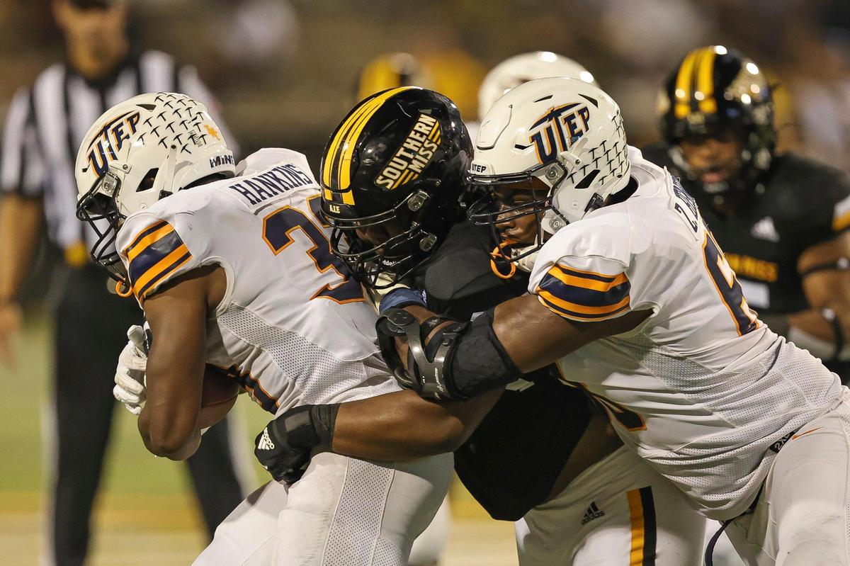 Southern Miss Golden Eagles defensive lineman Josh Carr Jr. (45) tackles UTEP Miners running back Deion Hankins (33) during the game between Southern Miss and UTEP at Hancock M.M. Roberts Stadium, Hattiesburg, MS, October 9, 2021.