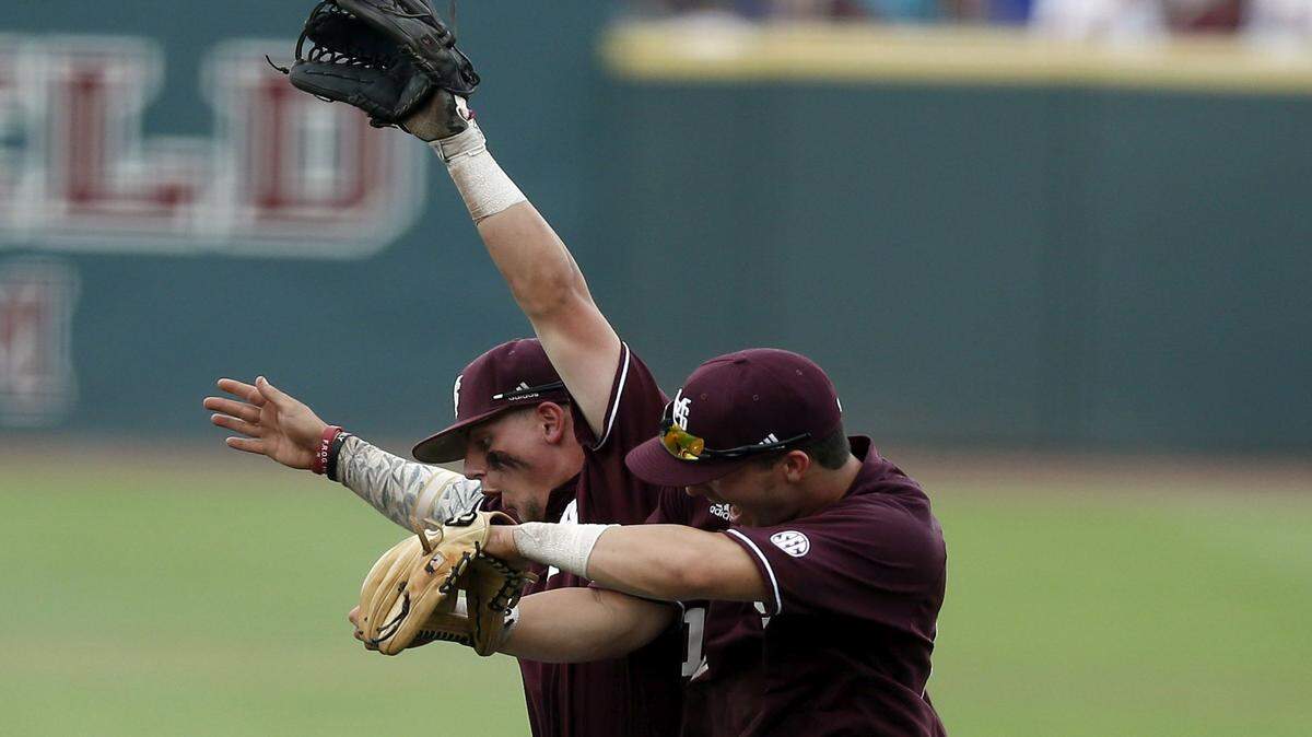 Mississippi State baseball players celebrate winning their game against Southeast Missouri State in an NCAA college regional baseball tournament game in Starkville, Miss., Friday, June 3, 2016. (AP Photo/Rogelio V. Solis)