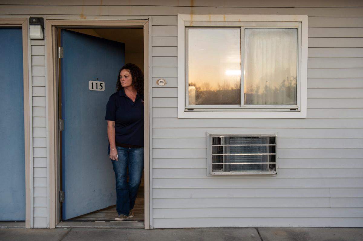 Tiffany Scheid, who was the manager at Motel 6 in Bay St. Louis on Dec. 14 when two police officers were shot and killed in the parking lot, stands in the doorway of the room the perpetrator — a veterinarian named Amy Brogdon Anderson — had rented the night of the shooting. Scheid said she has struggled with her mental health since the shooting, as she knew both of the officers — Sgt. Steven Robin and Branden Estorffe — and has since quit working at the motel.