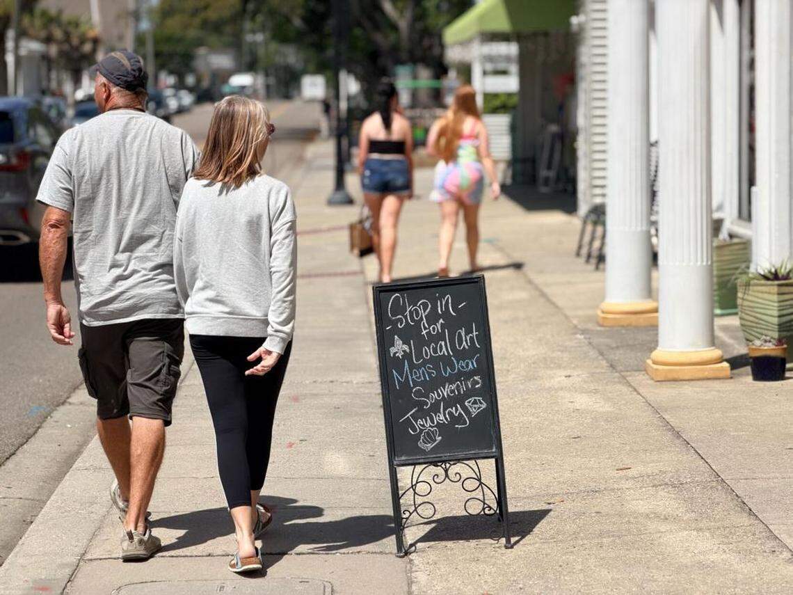 Visitors explore Bay St. Louis on April 7. Long a destination for Louisiana tourists, the city is now luring visitors from Alabama, Tennessee and across the country.