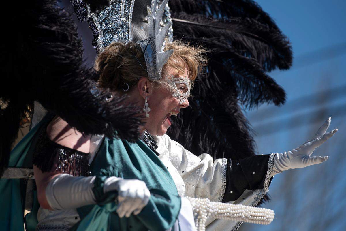 A member of the Krewe of Nereids court waves to the crowd during the Krewe of Nereids Mardi Gras parade on Highway 90 in Bay St. Louis on Sunday, Feb. 12, 2023.