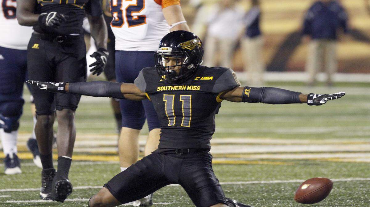 TIM ISBELL/SUN HERALD 
 Southern Miss defensive back Kalan Reed signals incomplete after breaking up a pass to UTAS's David Morgan II, Saturday, Oct. 17, 2015.