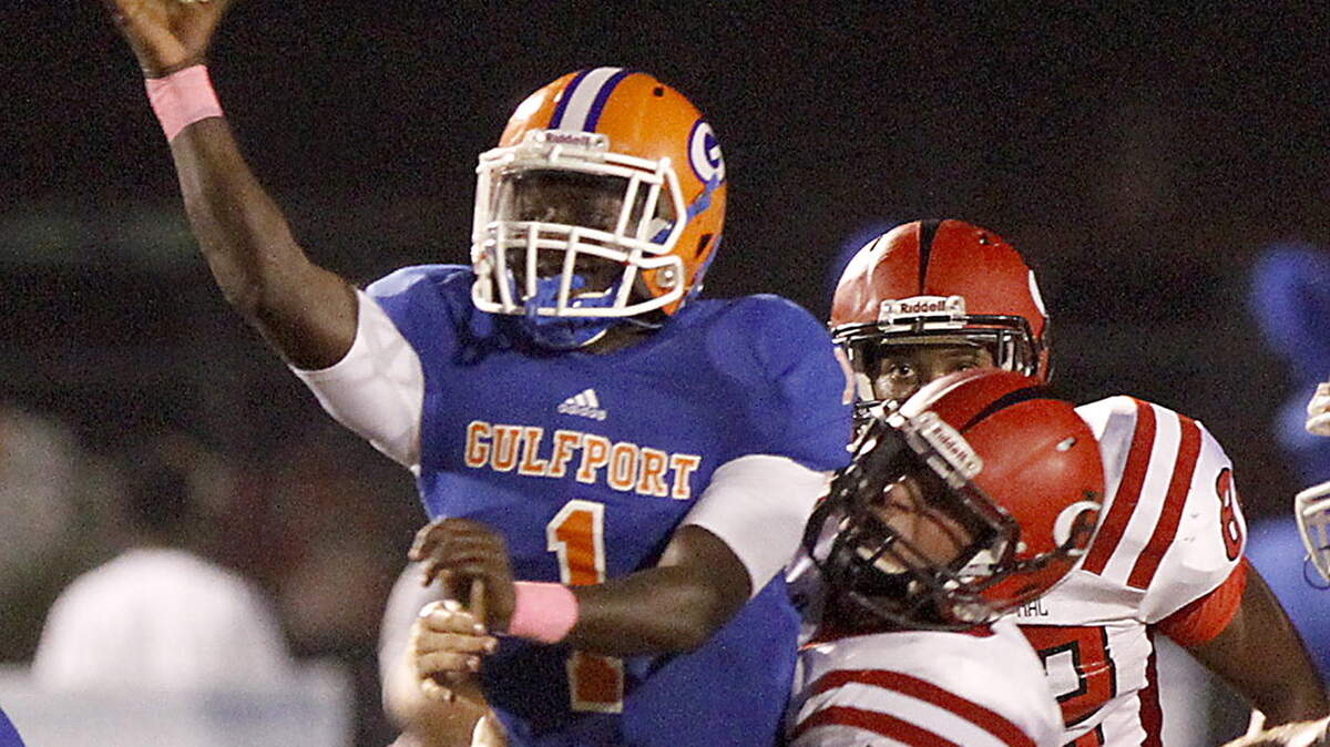 TIM ISBELL/SUN HERALD 
 Gulfport quarterback Cleveland Ford delivered a late touchdown pass to receiver Alton Conerly on Friday to keep the Admirals undefeated in Region 4-6A.
