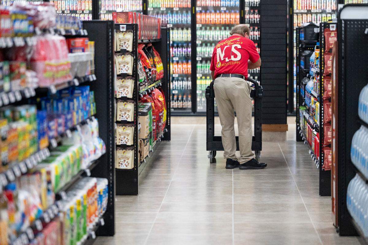 Workers restock shelves during opening day of Buc-ee’s first Mississippi location in Harrison County on Monday, June 9, 2025.