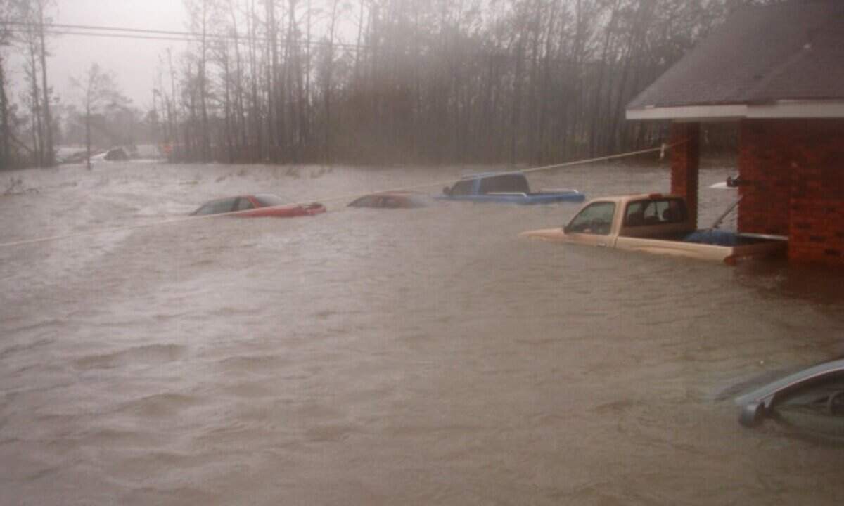 The storm surge from Hurricane Katrina came over the eave of the roof at the Apostolic Church of Our Lord Jesus in Waveland. As the water receded, it revealed the cars that belonged to the 20 people who had sought refuge in the church.