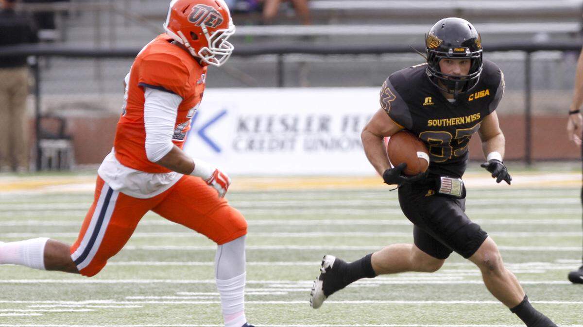 TIM ISBELL/SUN HERALD 
 UTEP's Nik Needham tries to run down Southern Miss receiver Casey Martin on Oct. 31 in Hattiesburg.
