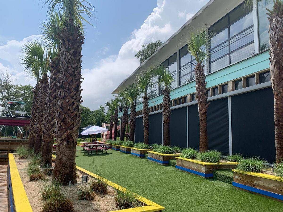The back porch of Flamingo Landing in Gulfport featured a turfed patio with seating.
