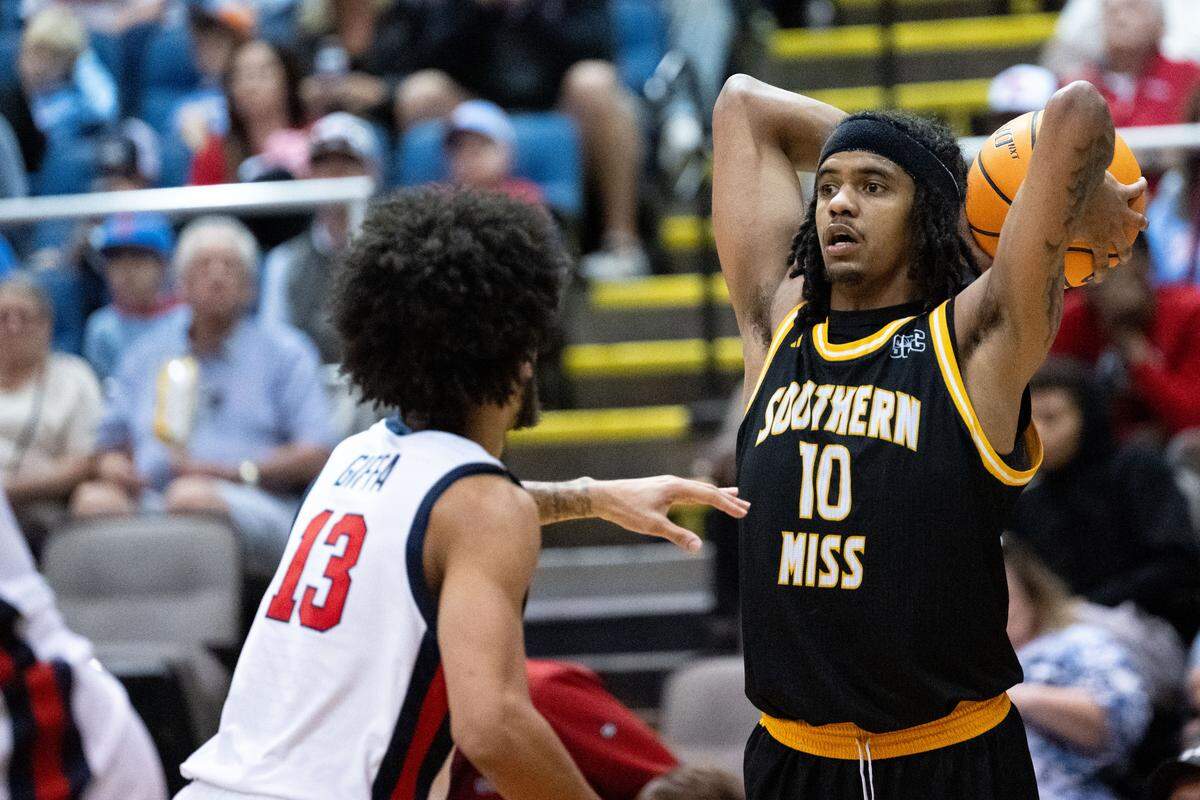 Southern Mississippi guard Isaac Taveras (10) looks to make a pass.