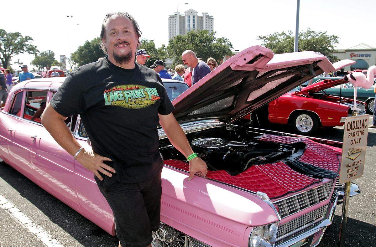 Randy Lejeune of Lake Charles and his pink 1965 Cadillac Fleetwood Limo on Friday, October 11, 2013, at Cruisin’ The Coast.