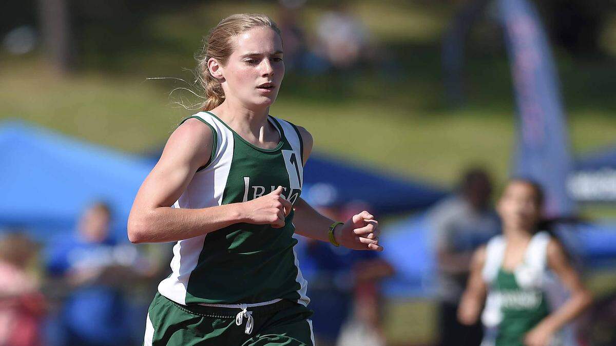 CHRIS TODD/SPECIAL TO THE SUN HERALD 
 St. Patrick's Ramsey Wagner leads teammate Isabel Leatherman around the final turn before winning the Class 3A 1600 meter run on Saturday, May 7, 2016, at the MHSAA Class 1A-3A-5A State Track Championships at Pearl High School in Pearl, Miss.