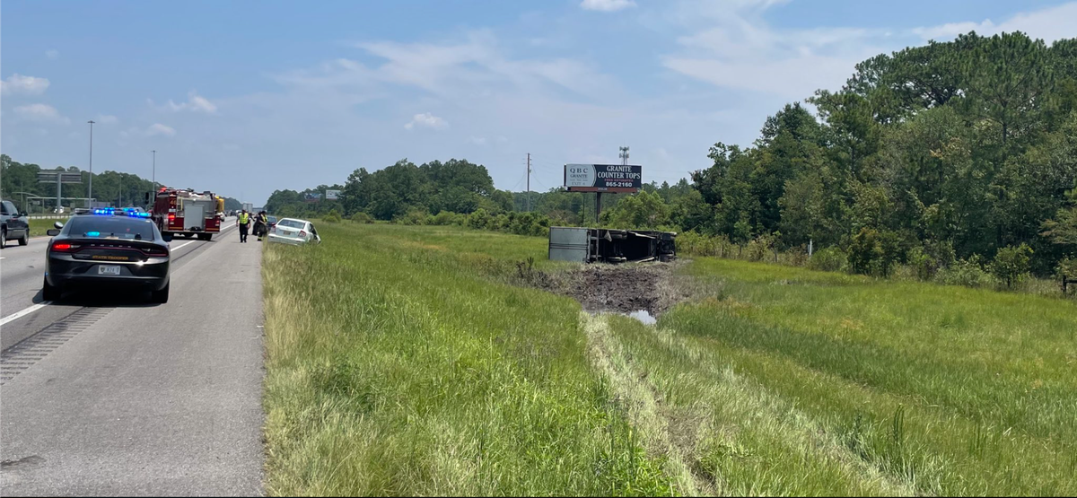 An overturned semi-truck leaking diesel fuel caused delays of two and a half hours near the MS-AL state line.