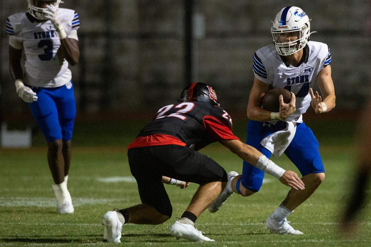 St. Stanislaus’ Chesley Rhodes tackles Stone’s Conner Rice during a game against St. Stanislaus at St. Stanislaus High School in Bay St. Louis on Friday, Sept. 29, 2023.