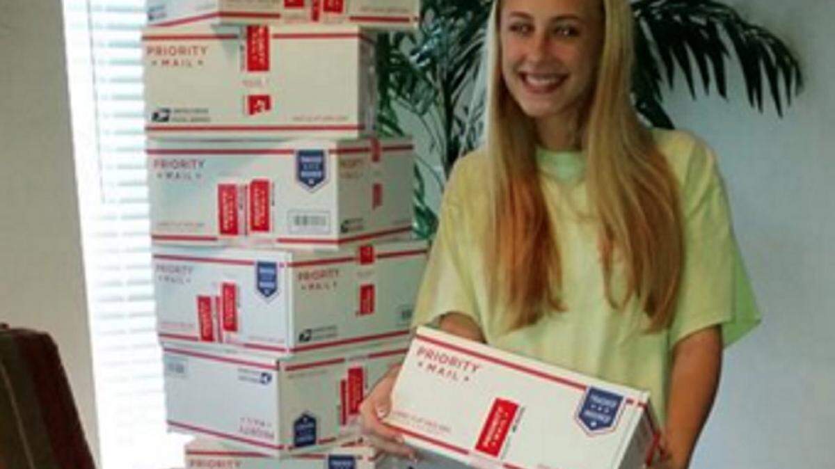 COURTESY KYLIE TUTTLE 
 Ocean Springs Cotillion Organization President Kylie Tuttle shows some of the items the group collected and shipped to Wounded Warriors.