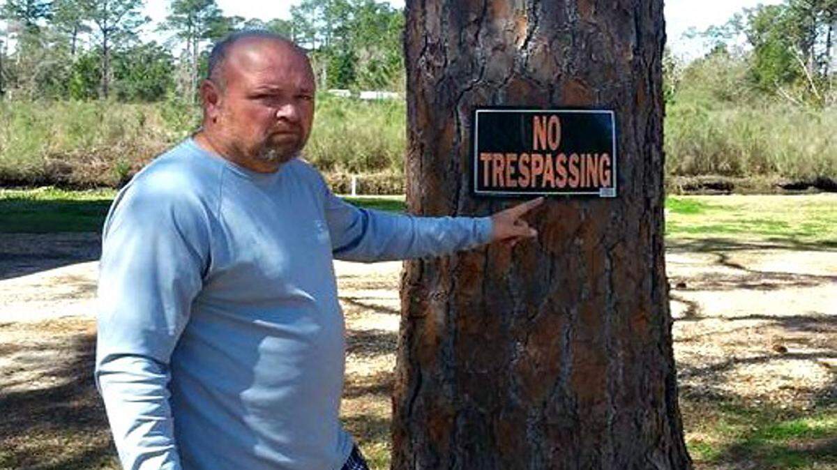 DWAYNE BREMER/SEA COAST ECHO 
 Mike Hearty of Waveland said the burglar he caught at his home Monday paid no attention to a sign in his yard.