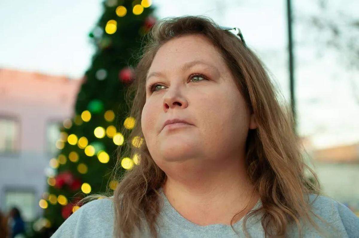 Emily Donovan, president of the Belzoni Humphreys Development Foundation, observes attendees of the Christmas Farmers and Crafters Market in Belzoni, on Dec. 5, 2023.