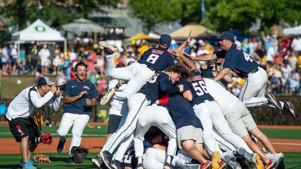 Ole Miss players dog pile after winning a shot at the College World Series during the Super Regionals Final at Pete Taylor Park in Hattiesburg on Sunday, June 12, 2022.