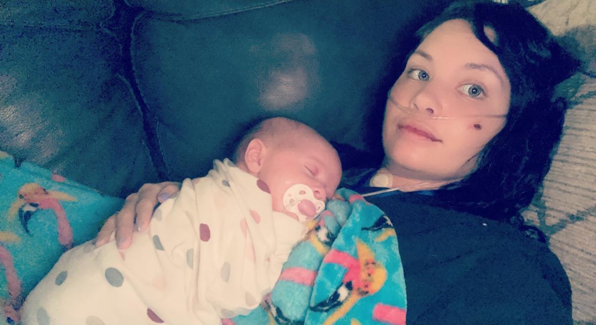 COVID survivor Taylor Manning and her newborn daughter, Maevi, at home in Ocean Springs.