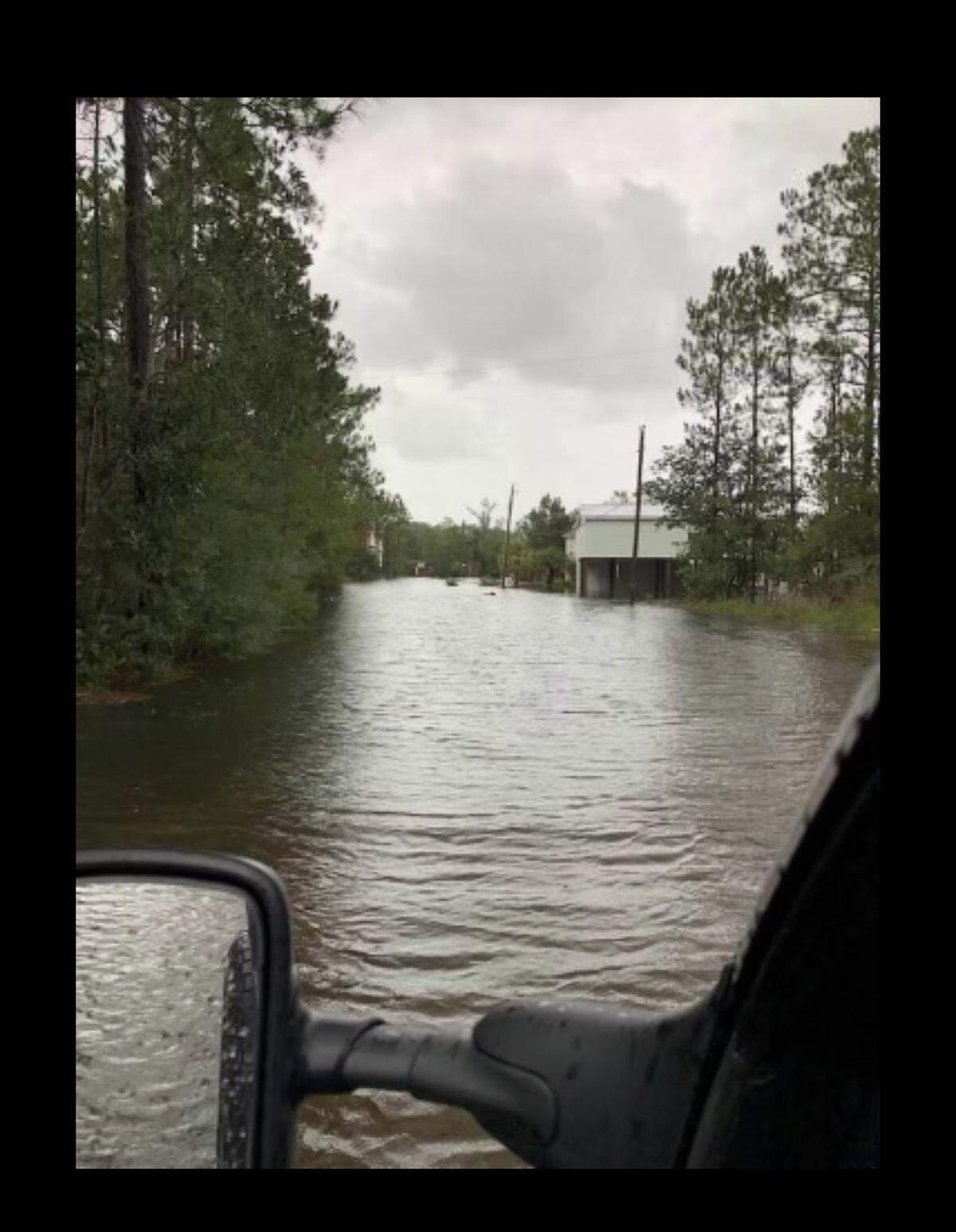 Streets are completely flooded in the Jourdan River Shores community in Kiln on Aug. 29, 2021, during Hurricane Ida.