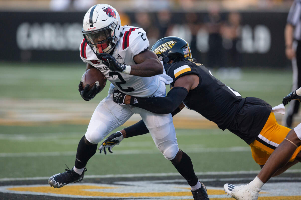 Southern Miss Golden Eagles defensive back Eric Scott Jr. tackles Arkansas State Johnnie Lang Jr. during a game against Arkansas State at M.M. Roberts Stadium in Hattiesburg on Saturday, Oct. 15, 2022.