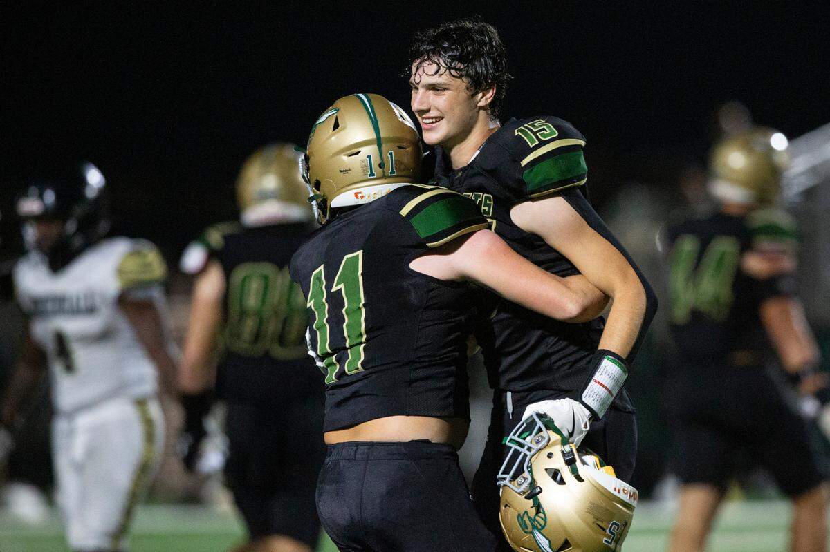 Poplarville’s Chadwick Brown and Jeremiah Moss celebrate after winning a playoff game between Poplarville and Mendenhall at Poplarville on Friday, Nov. 8, 2024.