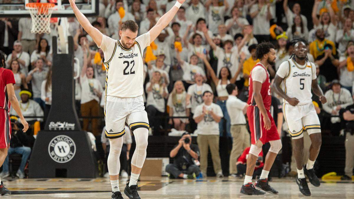 Southern Miss’s Felipe Haase hypes up the crowd during a game against Louisiana-Lafayette at Reed Green Coliseum on Thursday, Feb. 9, 2023.