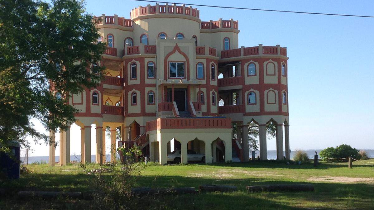 KAREN NELSON 
 
 The castle on East Belle Fontaine Beach south of Ocean Springs in Jackson County is for sale, as is, for $2 million. Made of poured concrete, it's neat inside, inspectors say. The rooms are round.