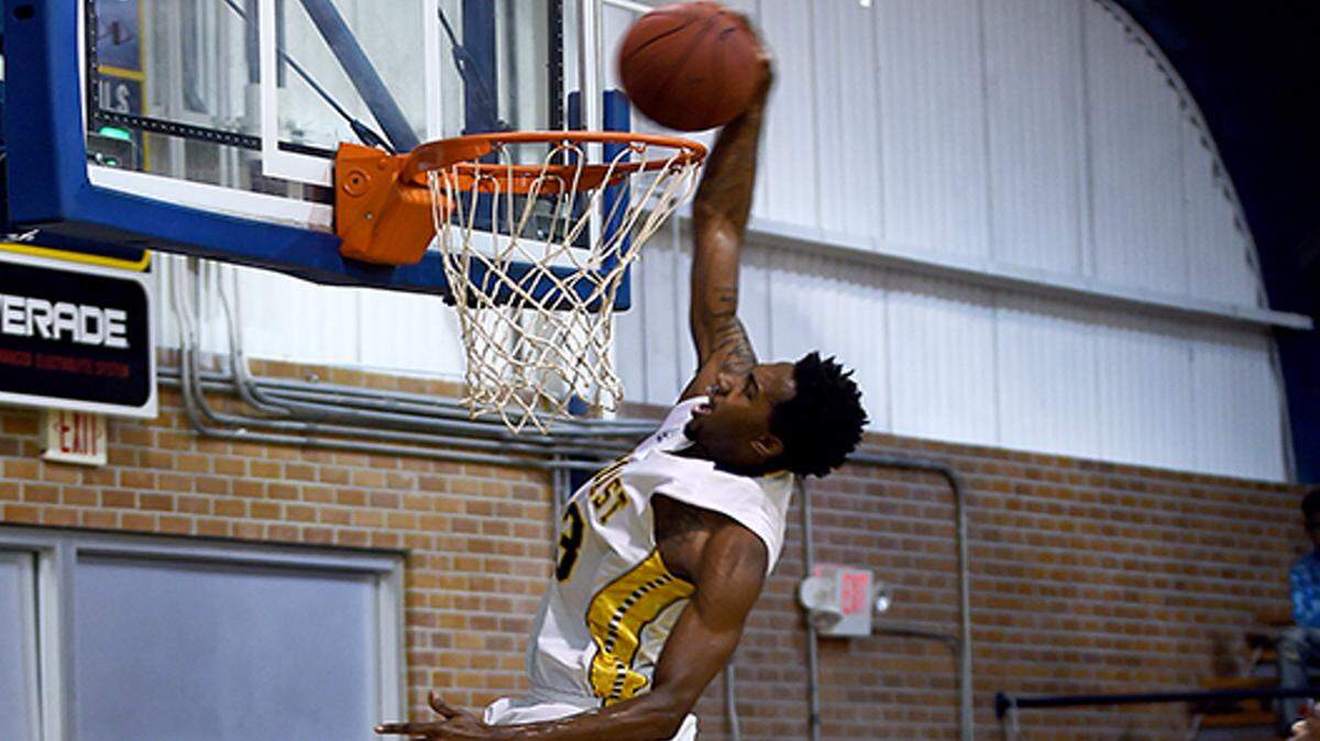 COURTESY MGCCC 
 Gulf Coast Community College's Davion Cole-Johnson dunks against rival Pearl River Community College on Thursday night.
