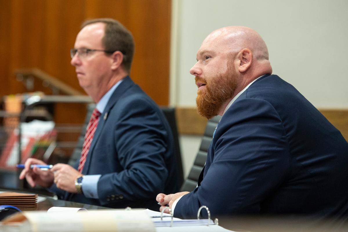 District Attorney W. Crosby Parker, left, and Assistant District Attorney Ian Baker listen to Darian Atkinson’s attorneys during a competency hearing for Atkinson at Harrison County Circuit Court in Biloxi on Tuesday, March 25, 2025.