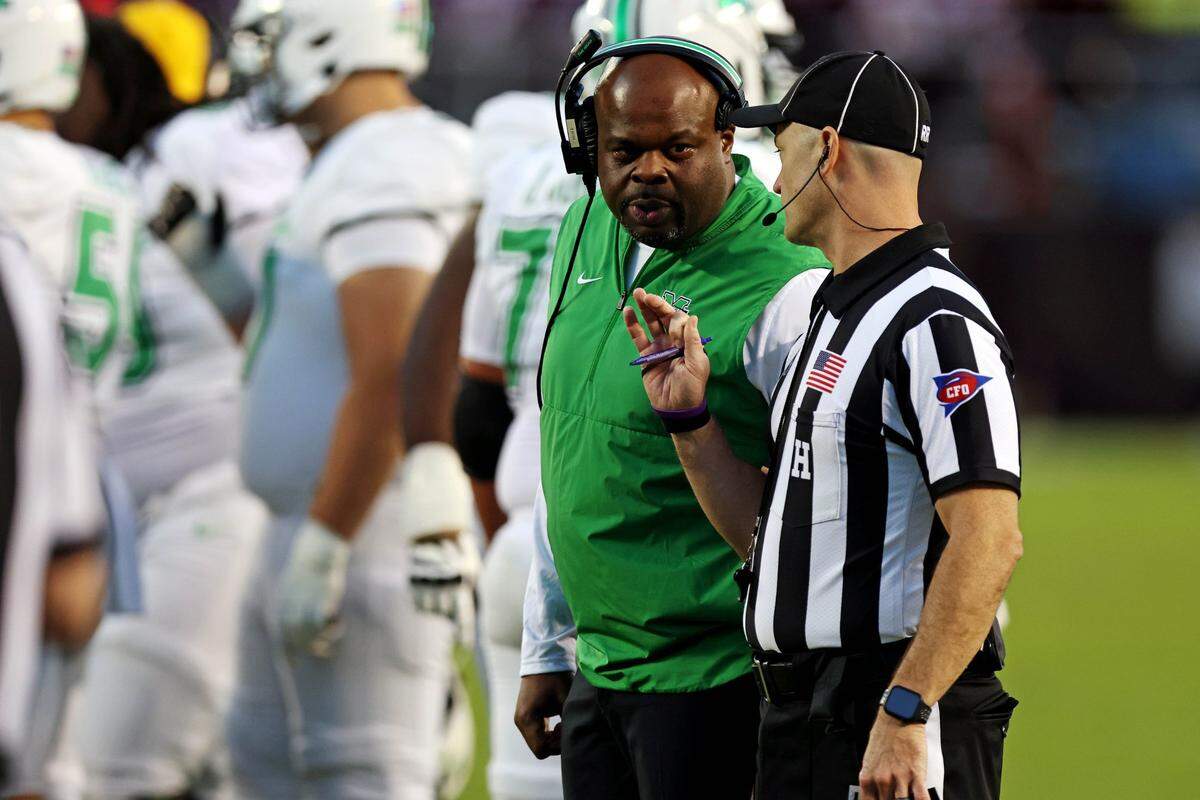 Sep 7, 2024; Blacksburg, Virginia, USA; Marshall Thundering Herd head coach Charles Huff talks to a referee during the second quarter against the Virginia Tech Hokies at Lane Stadium. Mandatory Credit: Peter Casey-Imagn Images