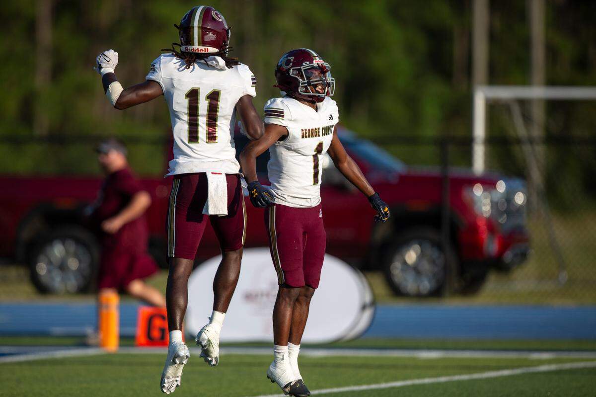 George County wide receiver Brenn Moody (#11) and running back Montrell Dortch (#1) celebrate after Moody scored a touchdown during a Jamboree game against St. Martin at St. Martin High School in Ocean Springs on Friday, Aug. 23, 2024.