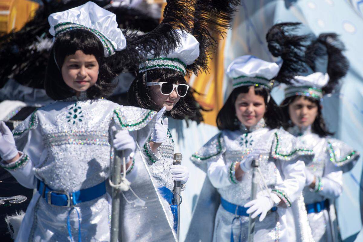 Court members ride on the queen’s float during the Krewe of Nereids Mardi Gras parade on Highway 90 in Bay St. Louis on Sunday, Feb. 12, 2023.