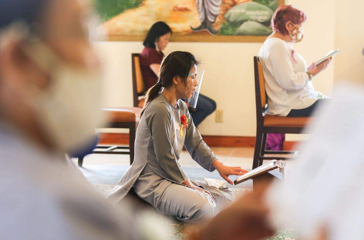 Prayers and chants are read during the Le Vu Lan service at the Chua Van Duc Buddhist temple in Biloxi Sunday, August 30, 2020.