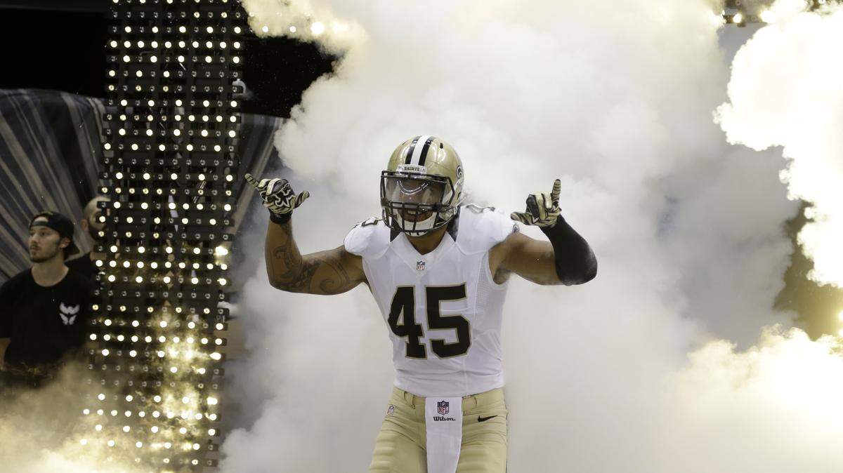 New Orleans Saints outside linebacker Hau'oli Kikaha (45) runs onto the field beforean NFL preseason football game against the Houston Texansin New Orleans, Sunday, Aug. 30, 2015. (AP Photo/Jonathan Bachman)