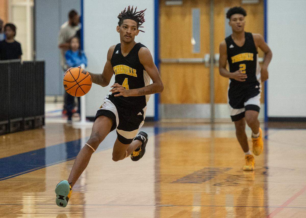 D’Iberville’s Dominic Simpkins dribbles the ball down the court during the Adidas Holiday Classic at Gulfport High School in Gulfport on Tuesday, Dec. 28, 2021.