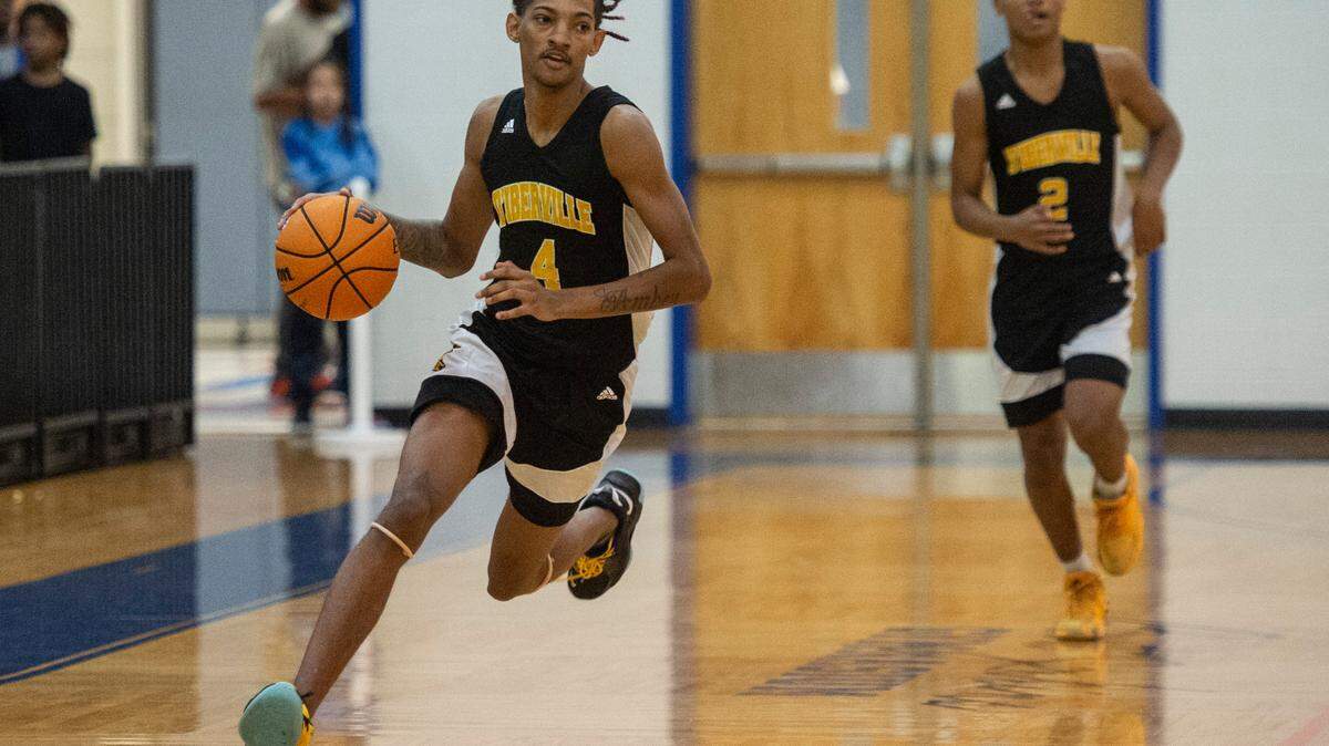 D’Iberville’s Dominic Simpkins dribbles the ball down the court during the Adidas Holiday Classic at Gulfport High School in Gulfport on Tuesday, Dec. 28, 2021.