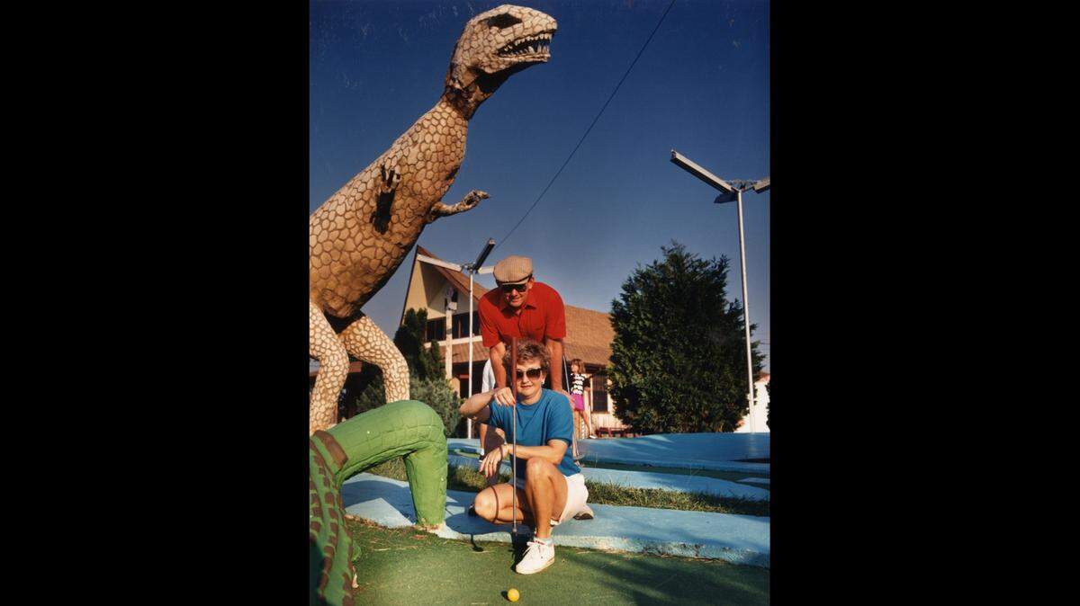 A dinosaur watches over a goofy golf game in South Mississippi before Hurricane Katrina. Many of the amusements and attractions on the beach were lost in the 2005 storm, but memories remain.