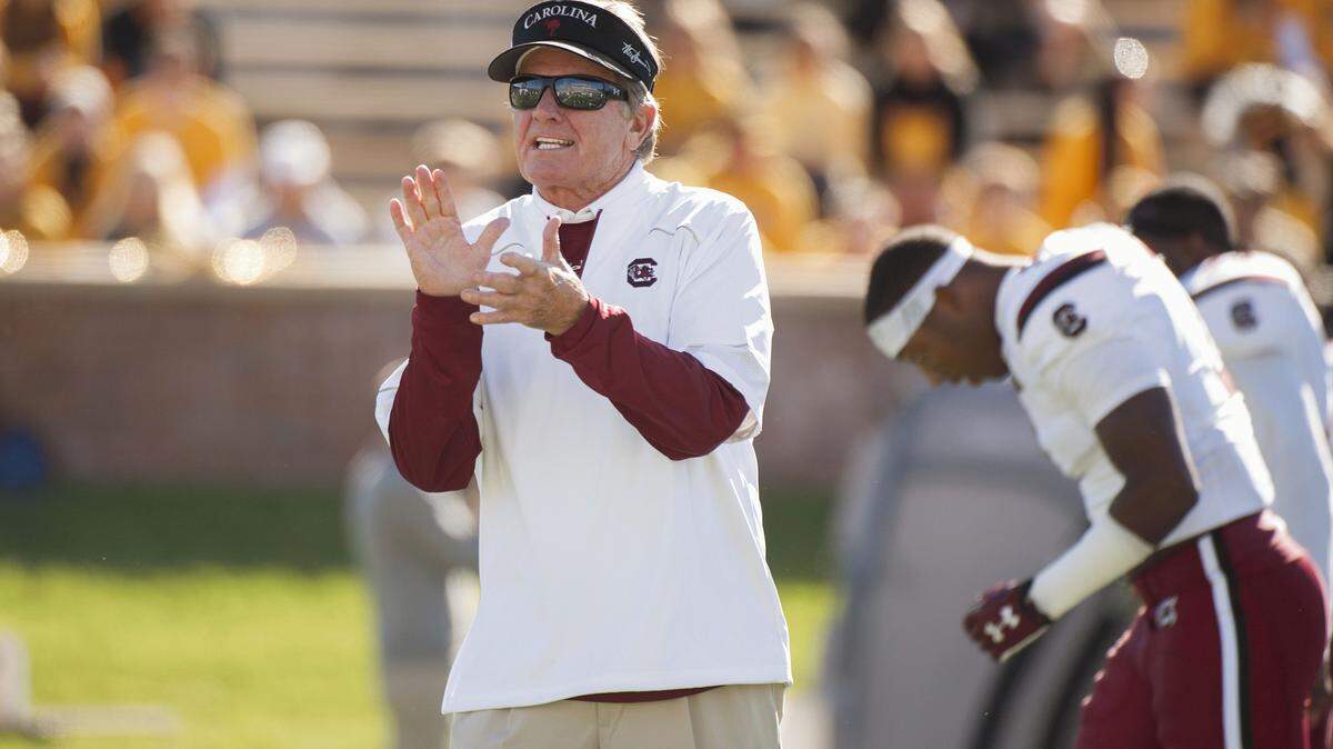 L.G. PATTERSON/ASSOCIATED PRESS 
 South Carolina head coach Steve Spurrier claps as his team warms up before a game against Missouri Saturday in Columbia, Mo.