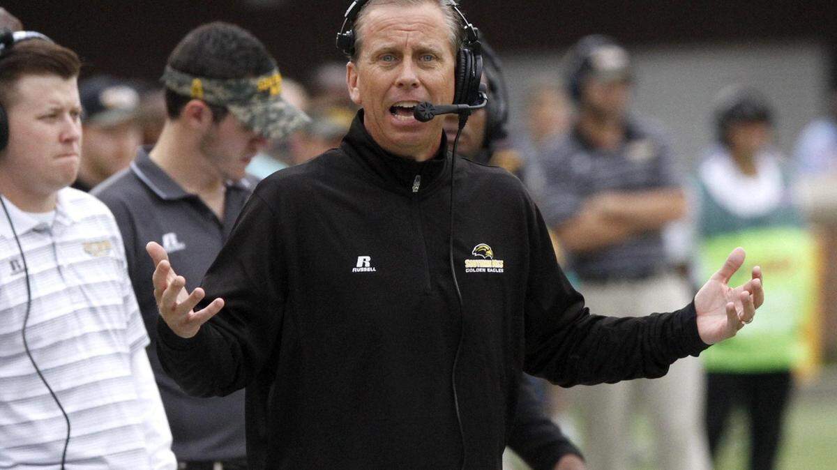 TIM ISBELL/SUN HERALD 
 Southern Miss coach Todd Monken pleads his case with the referee during the game against Old Dominion in Hattiesburg Saturday.