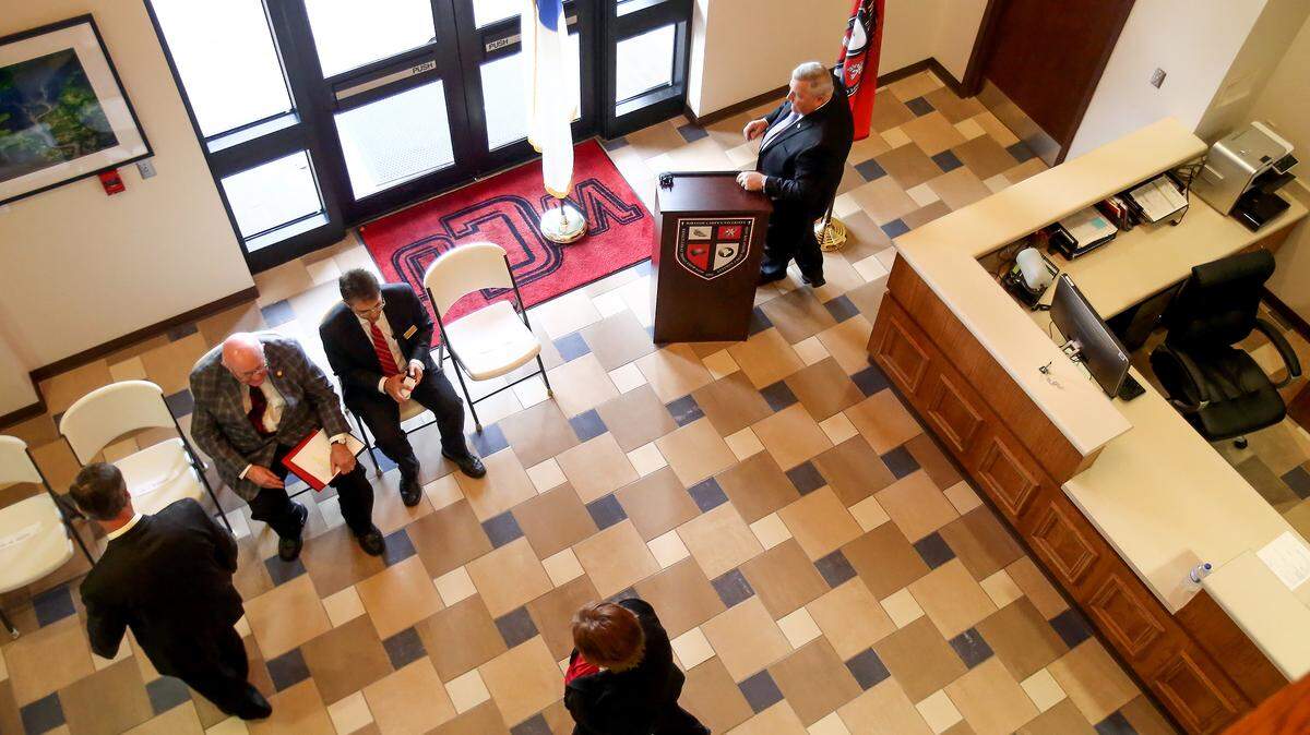 AMANDA McCOY/SUN HERALD 
 William Carey University faculty and officials take their seats for a gathering to announce the university's plans to open a pharmacy school by fall 2018.