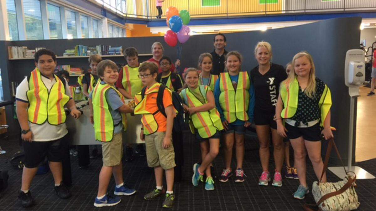 OCEAN SPRINGS SCHOOL DISTRICT 
 
 Elementary students gather at the YMCA to walk to the Upper Elementary School via the new Walking School Bus program, where students go door-to-door and pick up other students.