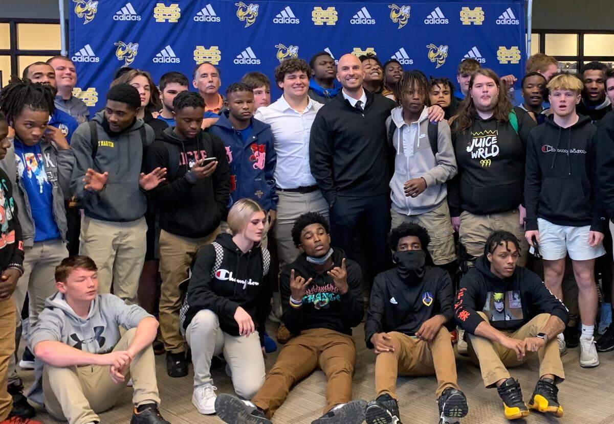 New St. Martin head football coach Ty Smith with his team at his introductory press conference