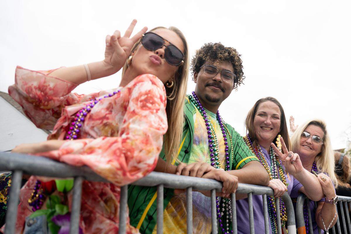 Members of the crowd pose for a photo.